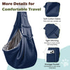 A navy blue fabric dog sling carrier with a storage pocket and tight stitching shown in detail.