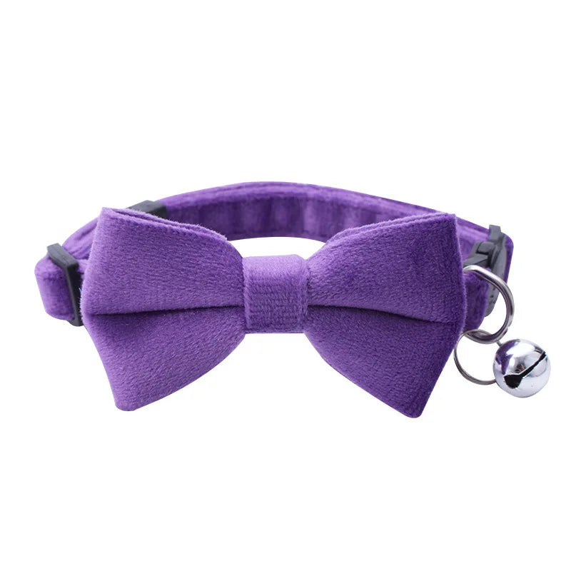Purple adjustable breakaway cat collar featuring a bow tie and silver bell.