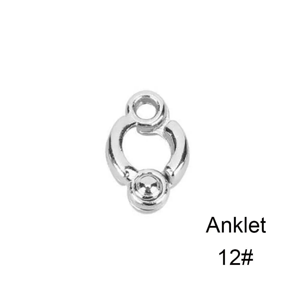 Silver ankle bracelet with a loop and a small ball charm.