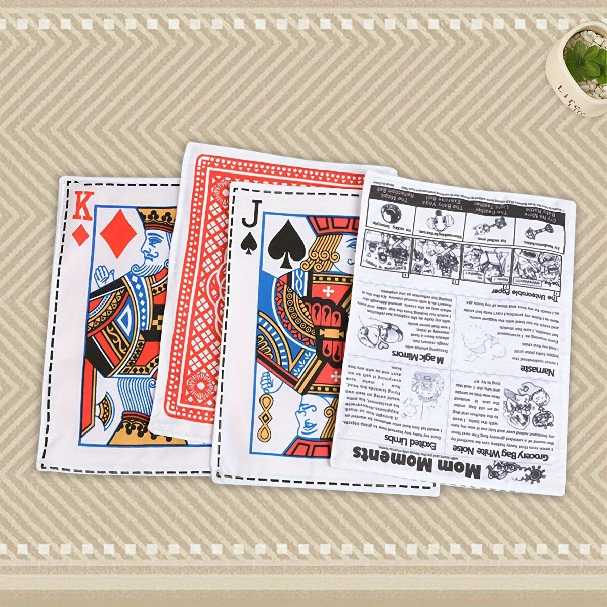 A set of playing cards featuring a King and Jack design displayed on a light surface.
