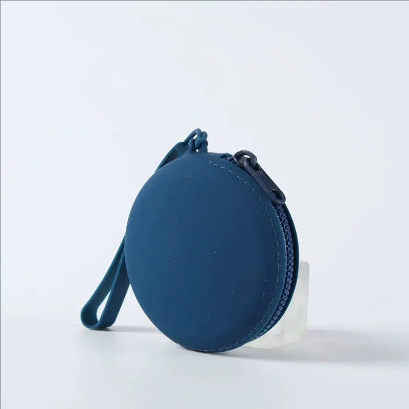 A dark blue silicone pet treat pouch with a zipper is shown against a white background.