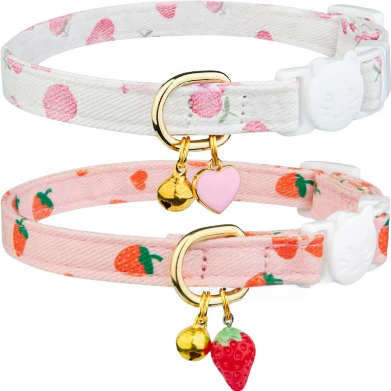 A pink and white floral breakaway cat collar with a bell and a small white tag.