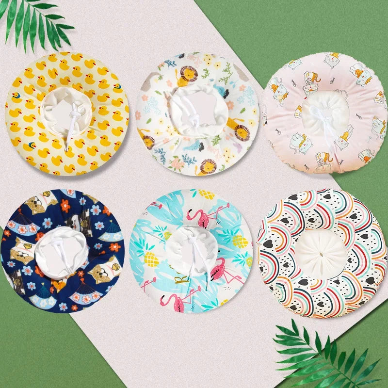 A collection of colorful, patterned soft cotton recovery collars for dogs and cats displayed on a light background.