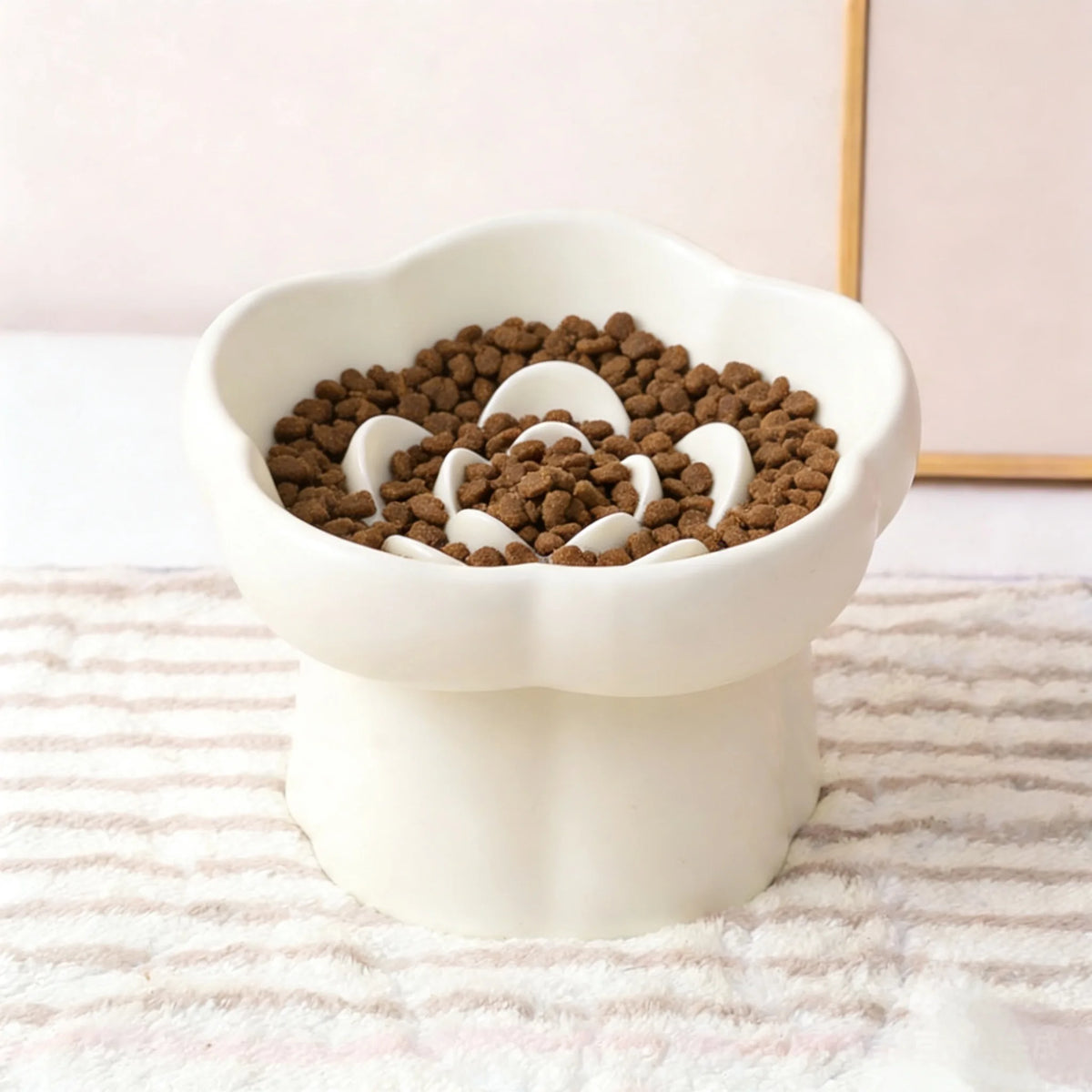White ceramic slow feeder bowl for pets featuring an anti-vomiting flower design.