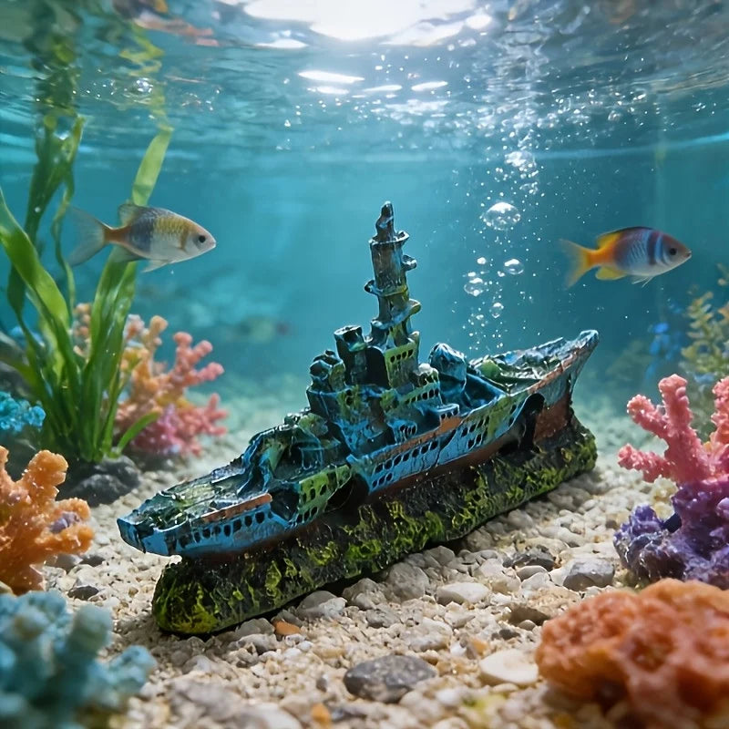 A detailed aquarium ornament shaped like a sunken ship with a cave hideout for fish tanks, resting on sand.