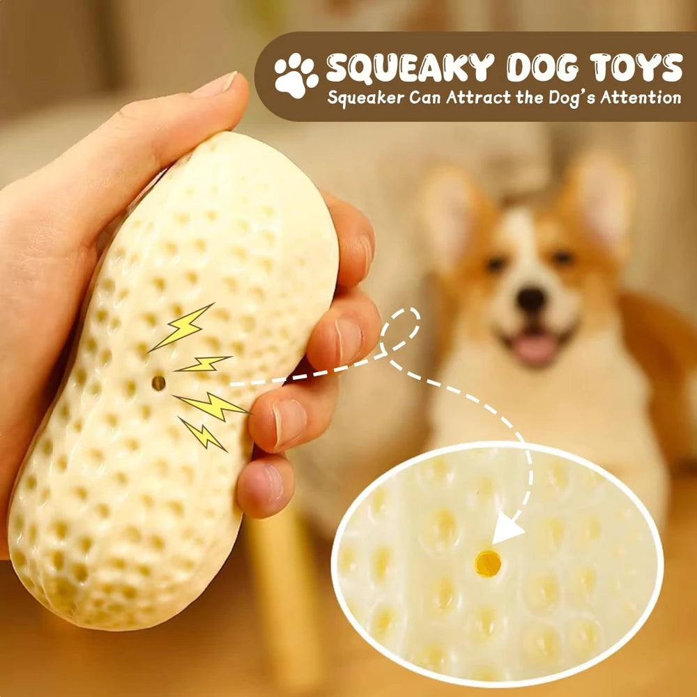 A hand holds a peanut-shaped squeaky dog toy, demonstrating how it can attract a dog's attention.