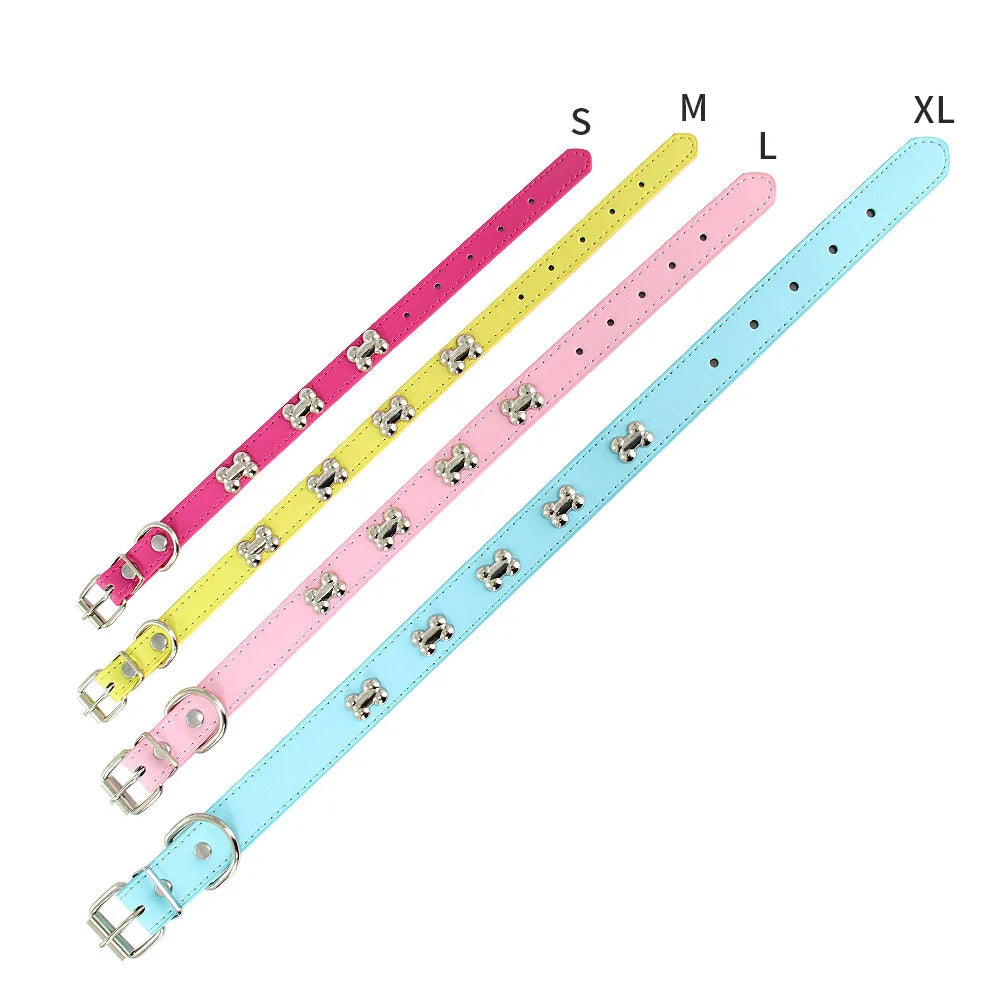 A set of colorful padded leather dog collars in sizes S to XL, featuring various pink, yellow, and blue neck straps.