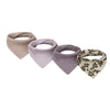 A set of four cotton baby bibs with printed designs for newborns in neutral and floral patterns.