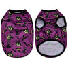 A purple pet shirt featuring a repeating pattern of black cats and Halloween pumpkins.