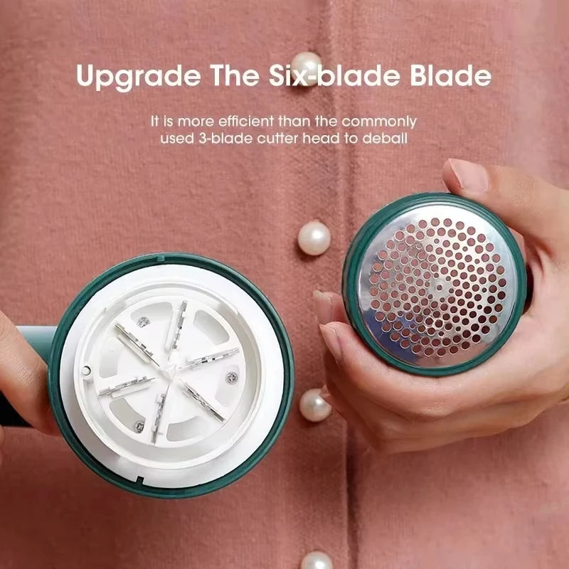 A hand holds a portable electric lint and fabric shaver with a green and silver head, demonstrating an upgrade to the six-bla