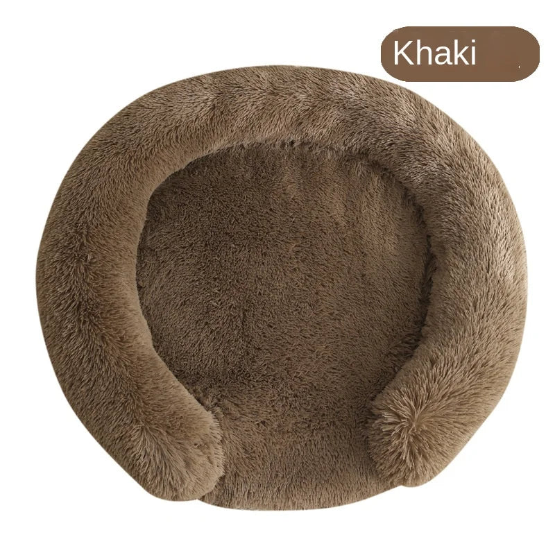 A round, brown faux fur dog bed with a removable cover.