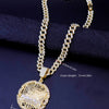 A gold plated last supper medallion necklace featuring a Cuban chain and a detailed pendant.