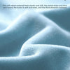 Close-up of soft, silky velvet fabric with subtle folds and texture.
