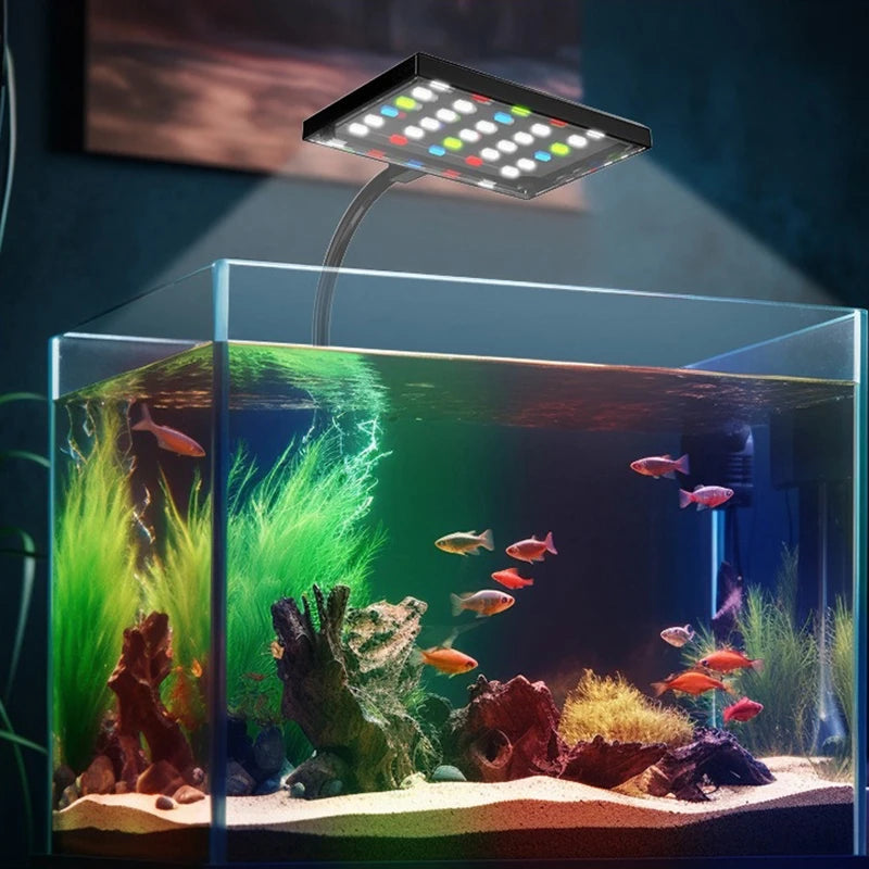 A full spectrum LED grow light illuminates a vibrant aquarium setup with aquatic plants and fish.