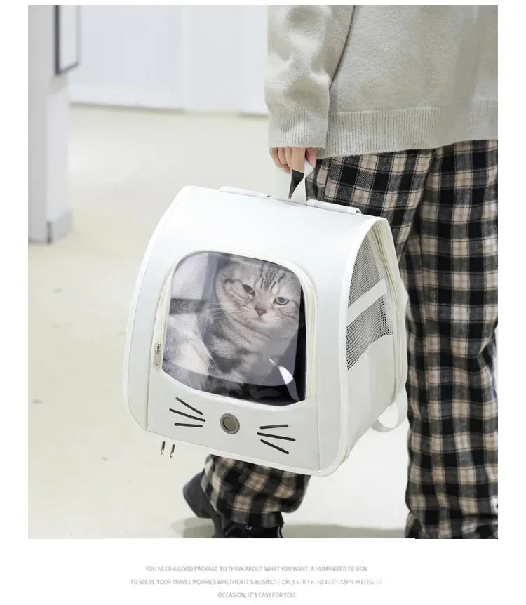 A person is holding a white breathable pet carrier backpack for cats and small dogs.