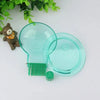 A clear plastic aquarium snail catcher with a green brush and a small trap for catching snails.