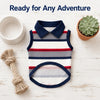 A striped classic pet polo shirt with a navy collar and dark blue trim is displayed on a white wooden surface.