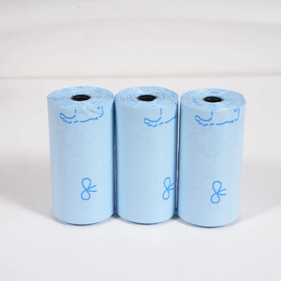 Three rolls of light blue thick dog waste bags with sweet patterns