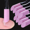 A hand holds a black nail file with pink buffer tools and a clear applicator tip.