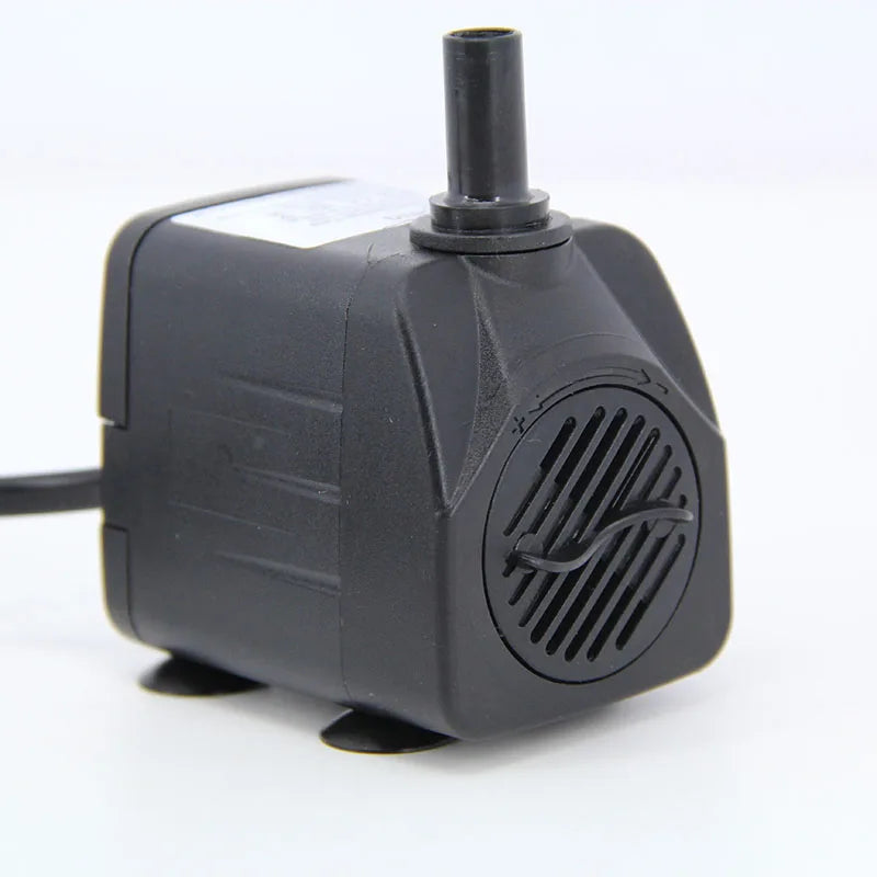 A black submersible aquarium water pump with a vertical nozzle and power cord.