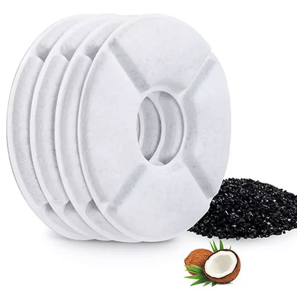 A stack of twelve white replacement filters for a cat water fountain, next to a half-cut coconut.
