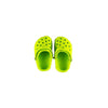 A pair of bright lime green non-slip pet sandals for dogs.