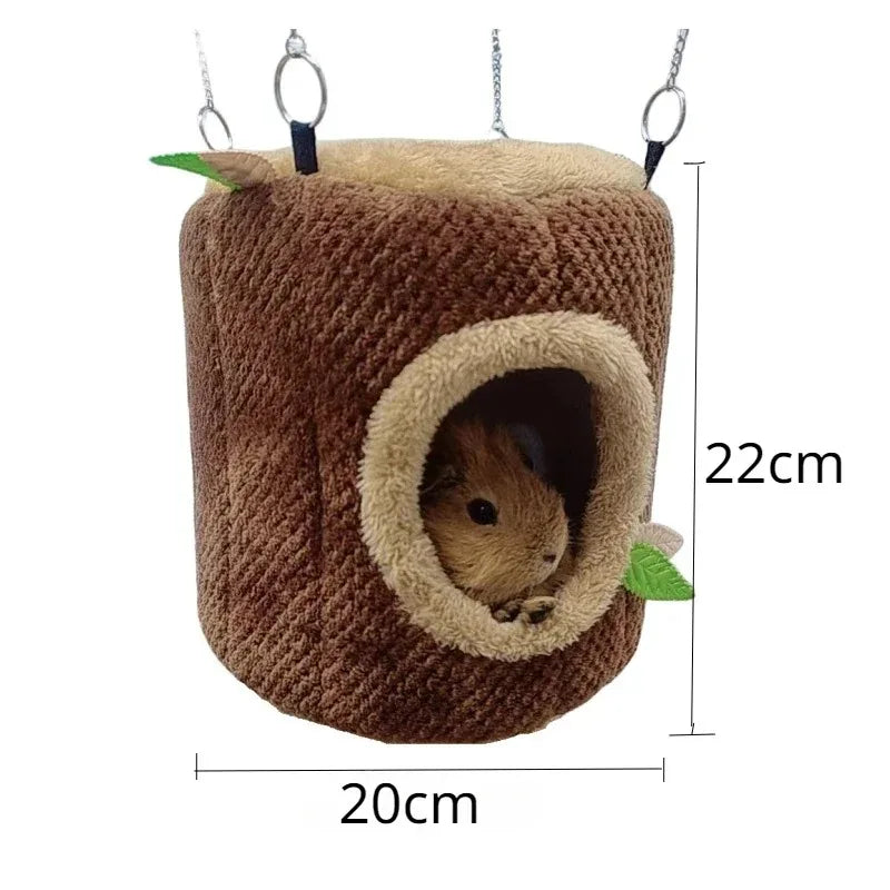 Cama de nido cilíndrica marrón para hámster, con exterior suave y agujero de entrada.