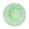 A round, light green plush pet bed with a textured, anti-slip surface.