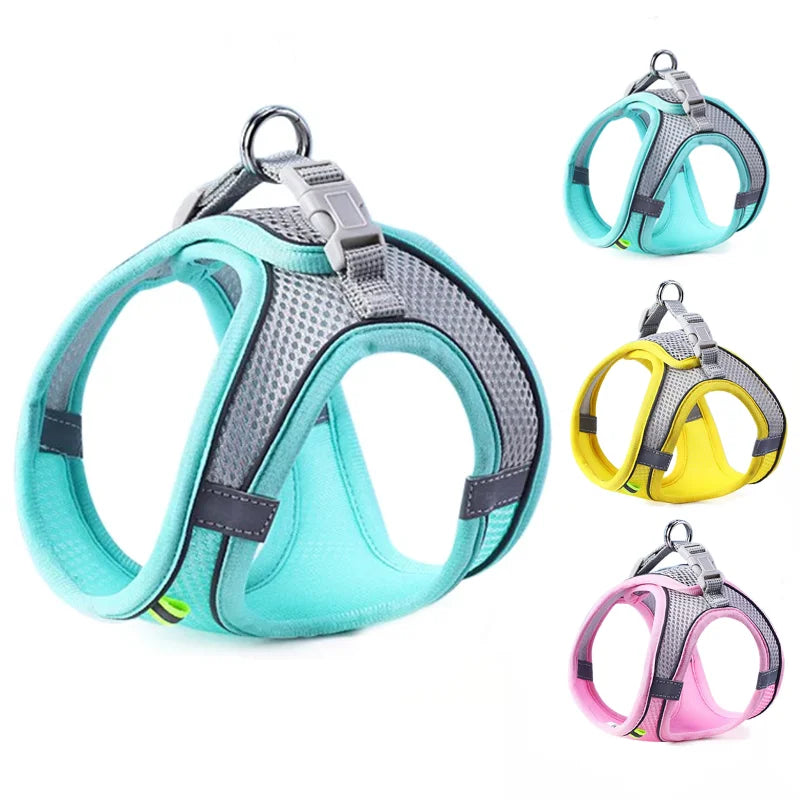 A set of reflective adjustable pet harnesses in teal, yellow, and pink colors.