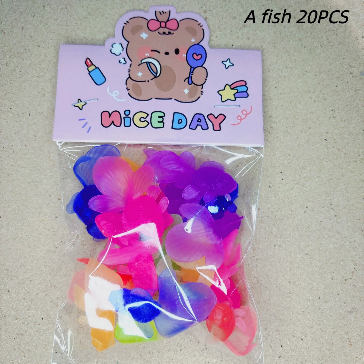 A set of 20 plastic fish bath toys in various colors and shapes packaged in a clear plastic bag.