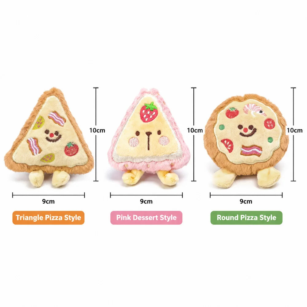 Three plush food-shaped dog toys: a triangle pizza, a pink dessert, and a round pizza.