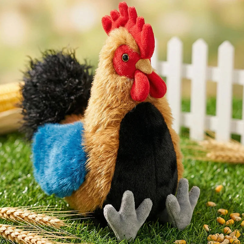 A lifelike plush rooster and hen set with brown, black, and blue feathers lying on green grass.