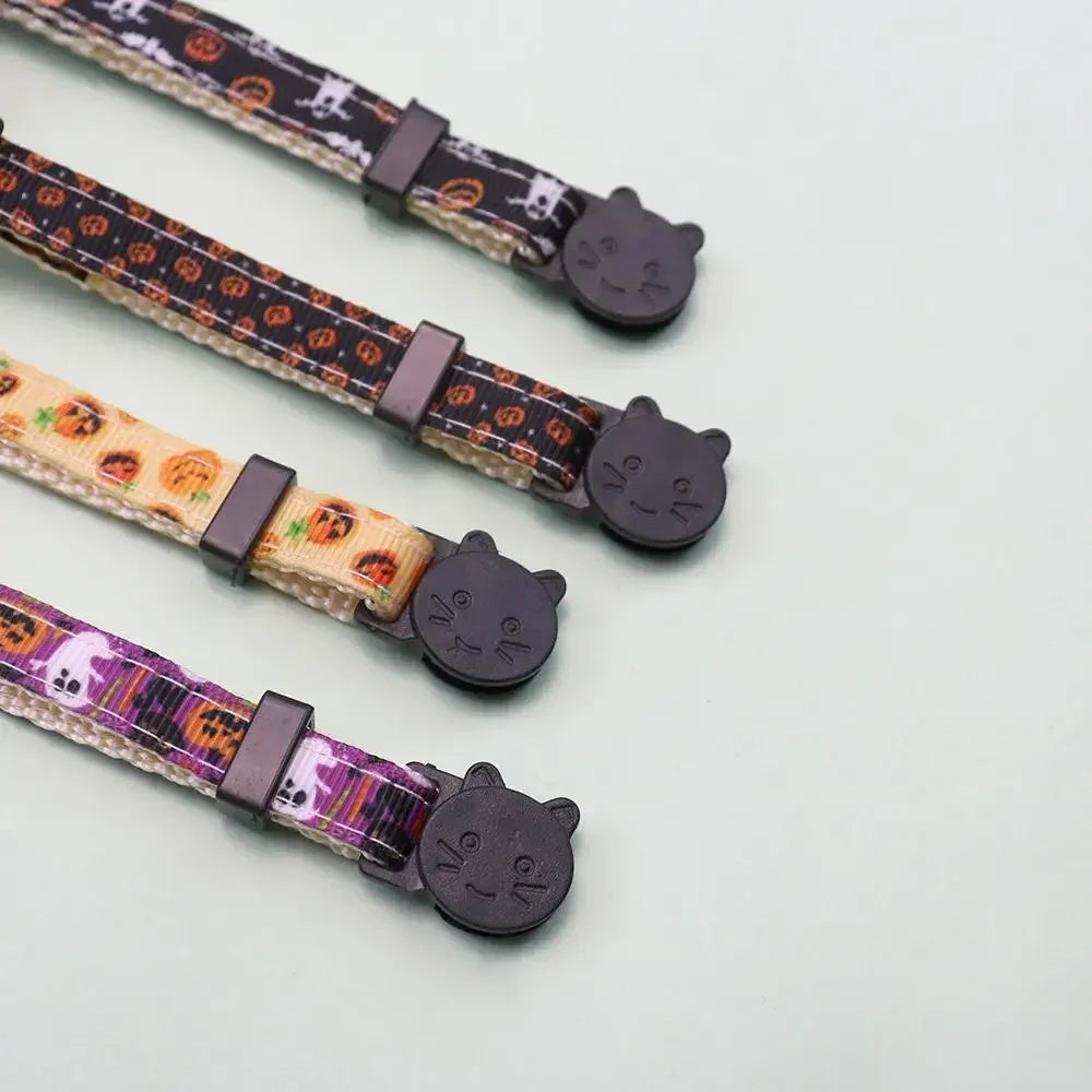 Three adjustable pet collars featuring Halloween patterns, bow ties, and small cat-like charms.