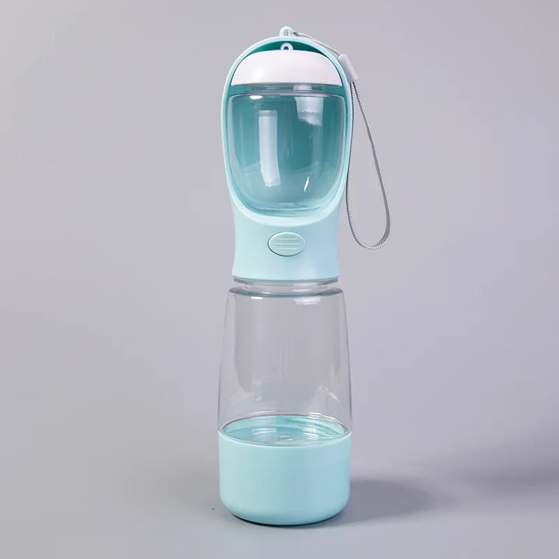 A light blue portable pet water bottle with a clear dispenser top and a silicone travel lid.