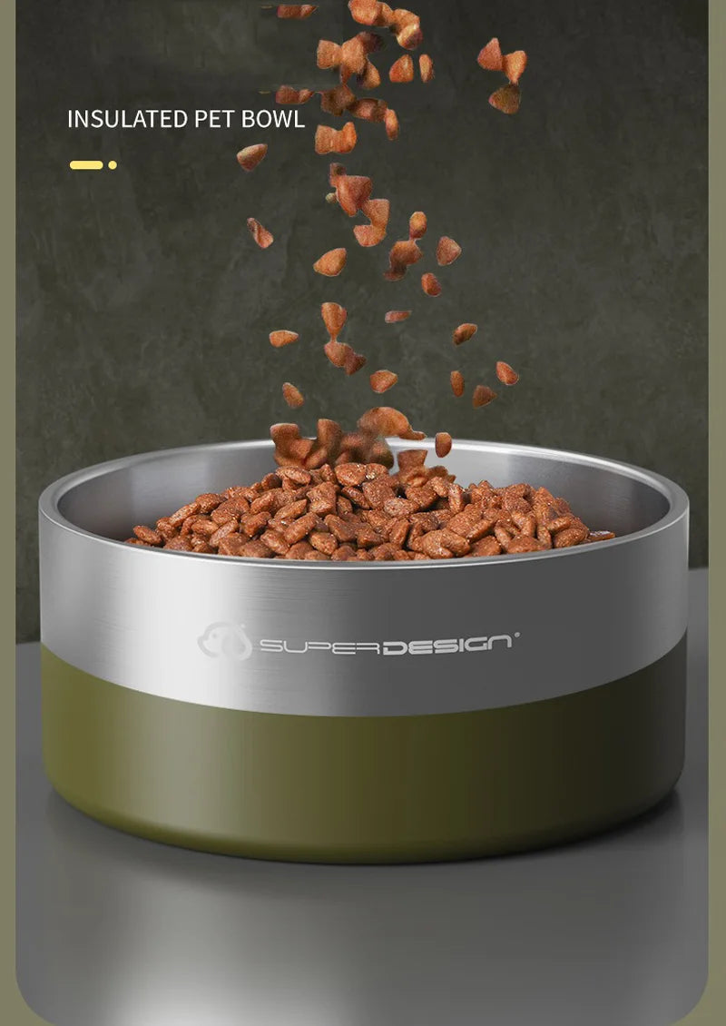 A stainless steel insulated pet bowl with a non-skid base is shown, filled with dry pet food being poured into it.