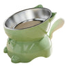 A light green elevated cat bowl with a stainless steel insert and a matching ceramic base.