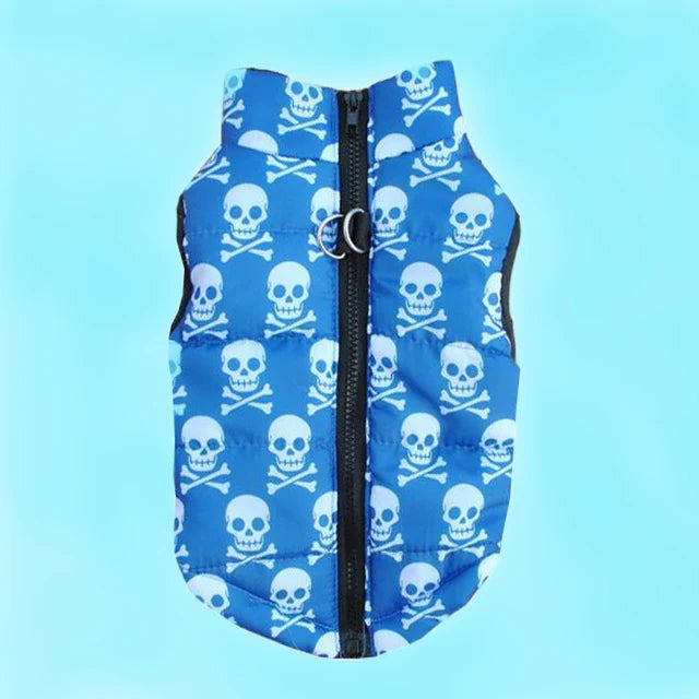Blue quilted dog coat with a skull and crossbones pattern and a zipper.