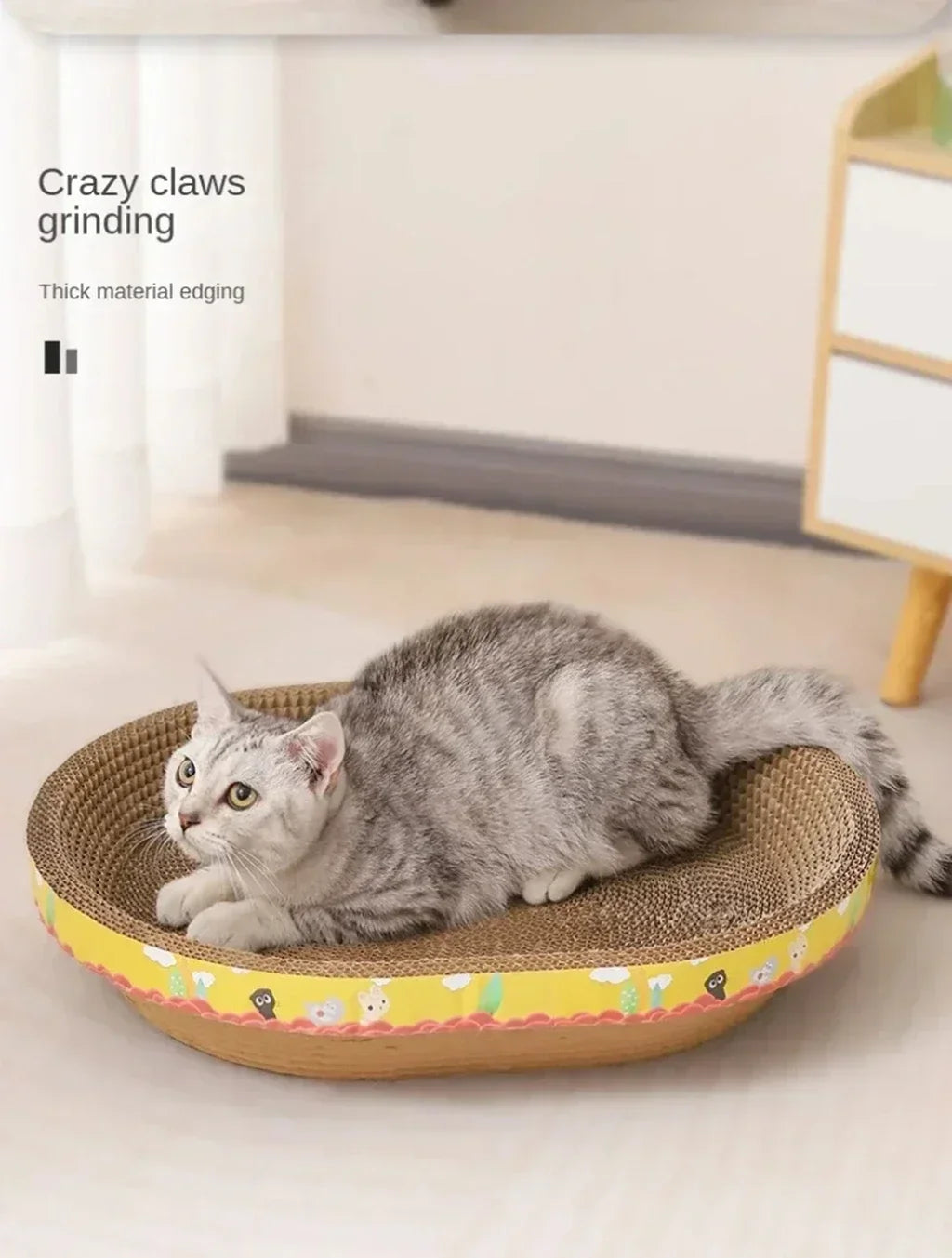 A gray kitten is resting on a woven cat scratching post designed for furniture protection.
