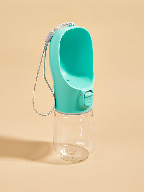 A teal portable pet water bottle with an integrated drinking bowl and a flexible silicone straw.