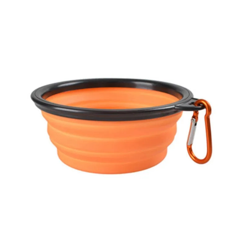 Orangefarbenes faltbares Silikon-Haustier-Transportschale mit schwarzem Rand und Tragegurt.