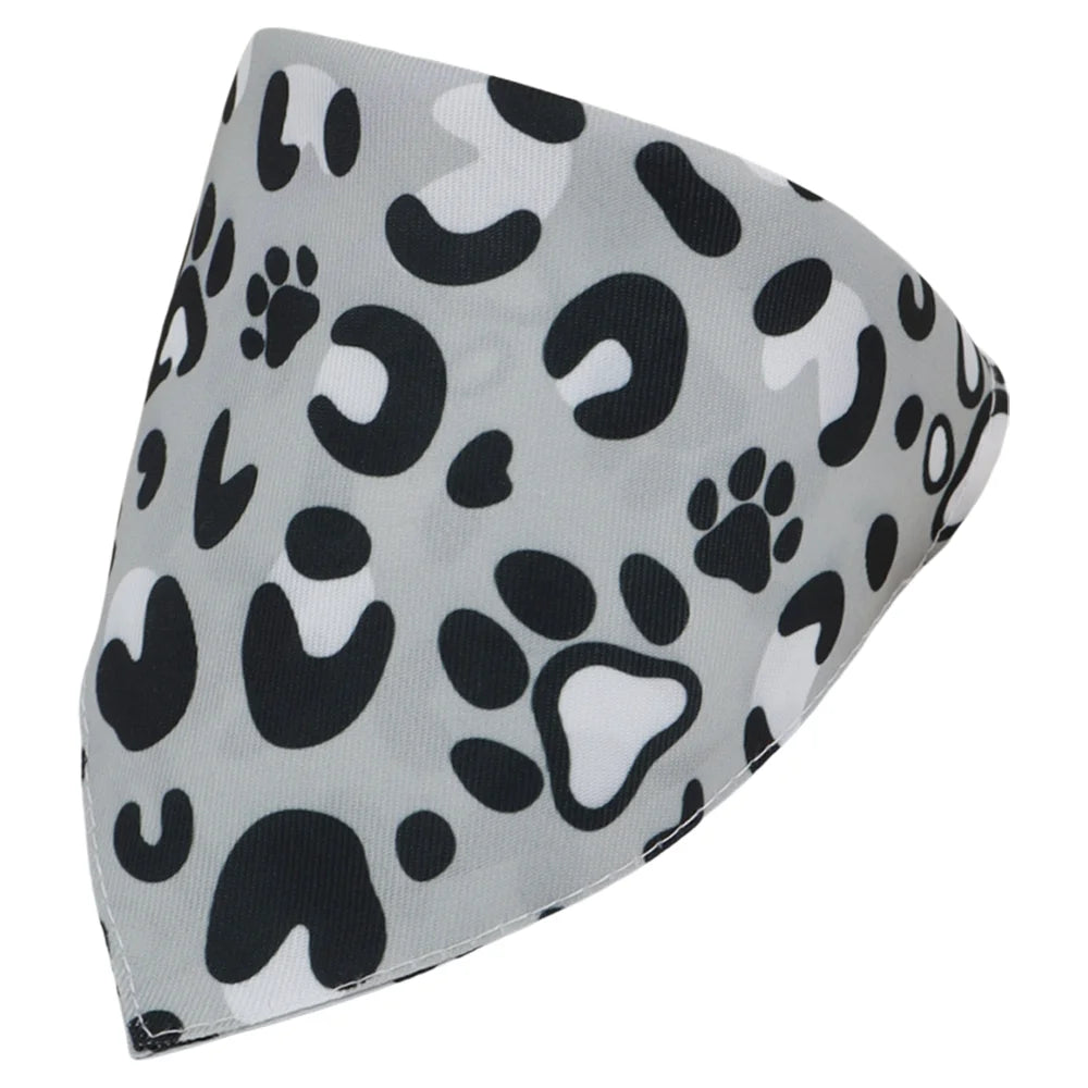 A gray and black leopard print bandana or triangle scarf for dogs and cats.