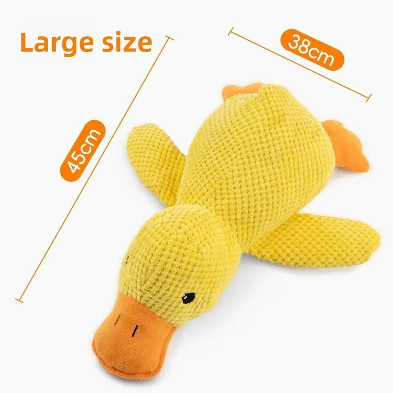 A yellow plush duck toy with an orange beak and feet, shown next to size indicators.