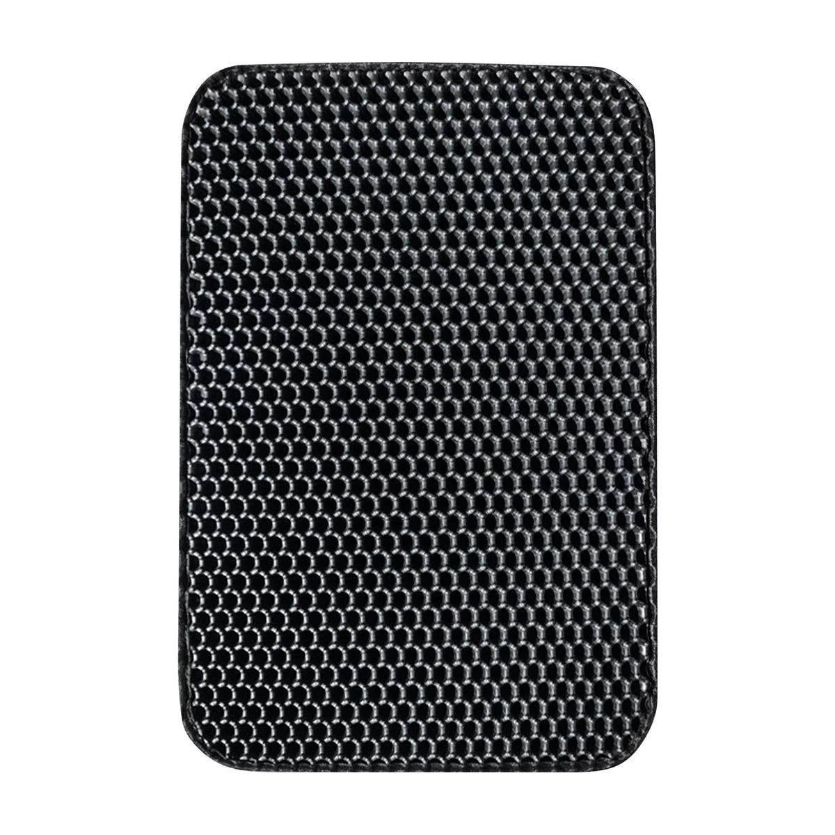 Tapis de litière pour animaux noir imperméable avec un motif texturé.