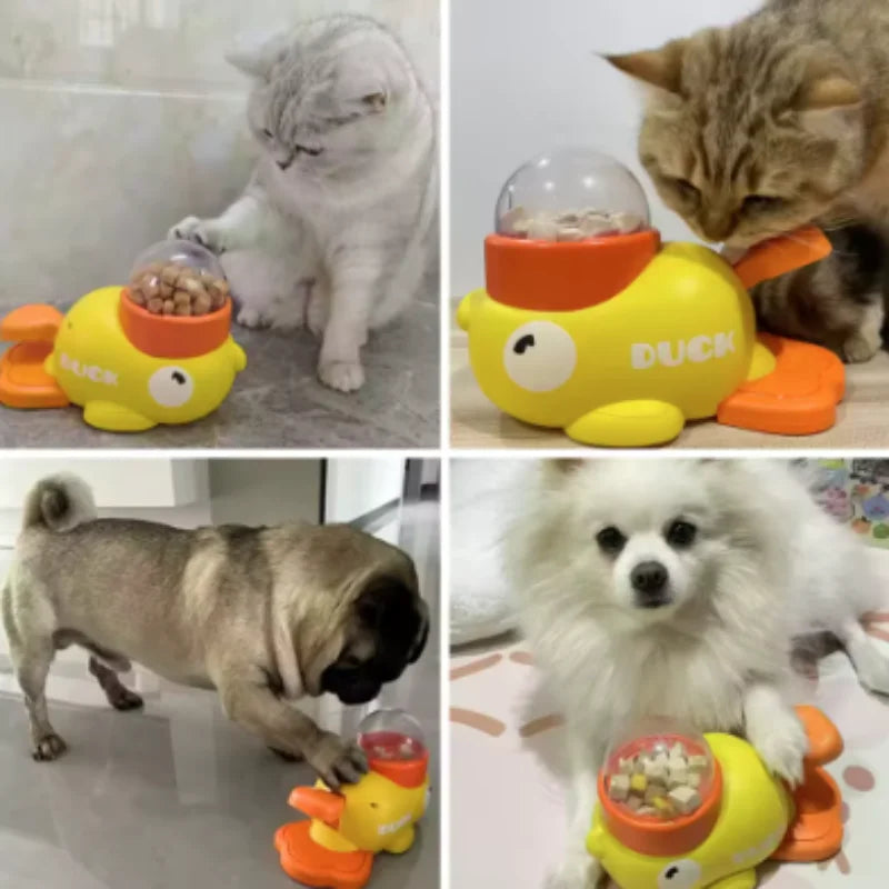 A yellow duck-shaped slow feeder puzzle toy for dogs is shown next to a cat and a dog.