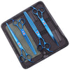 A black case holds a pair of blue professional stainless steel pet grooming scissors and a comb.