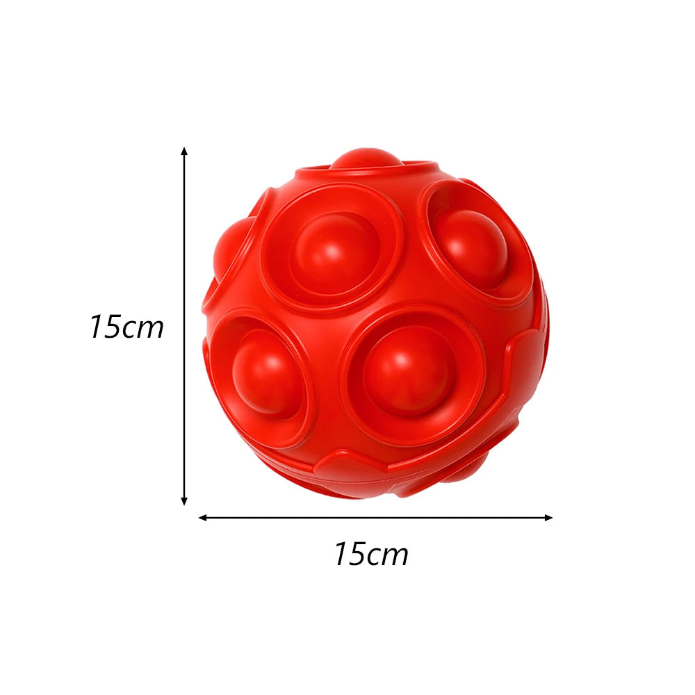 A bright red hexagonal TPR dog chew toy with multiple raised spheres for dental health and interactive play.