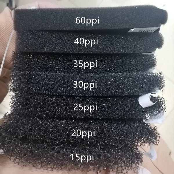 A stack of black aquarium biochemical sponge filters labeled with varying pore sizes from 60ppi down to 15ppi.