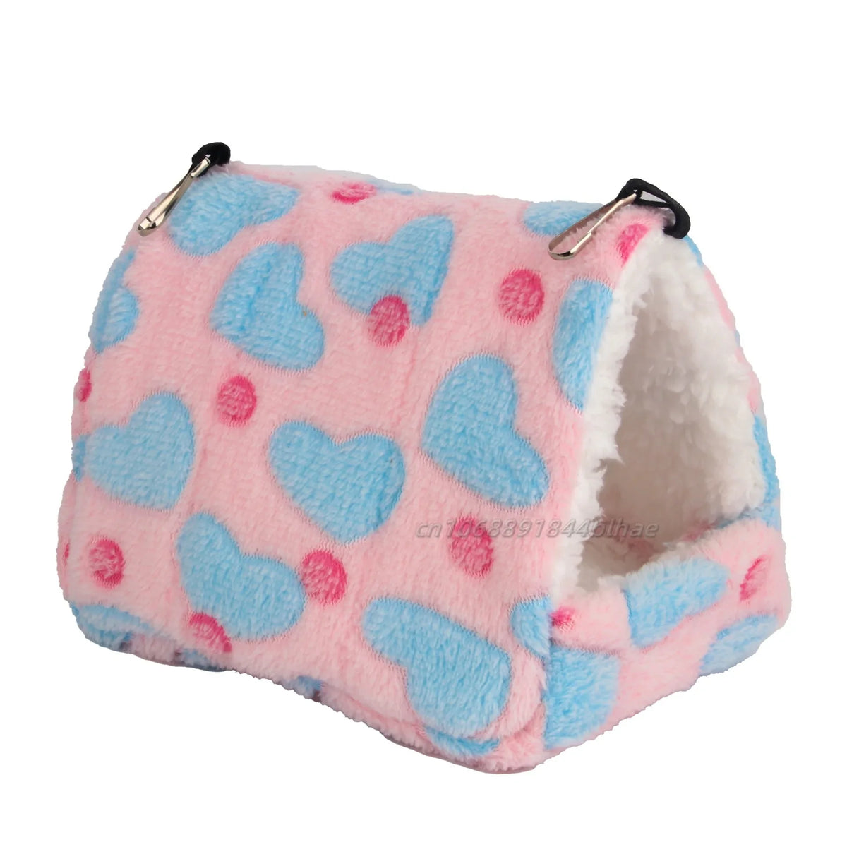 A pink and blue patterned fleece pet nest bed with white sherpa lining.
