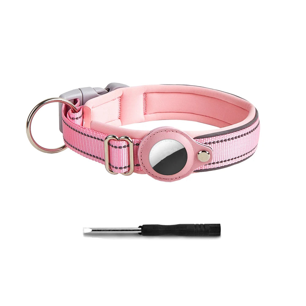 Pink reflective dog collar with a built-in AirTag holder and silver buckle.