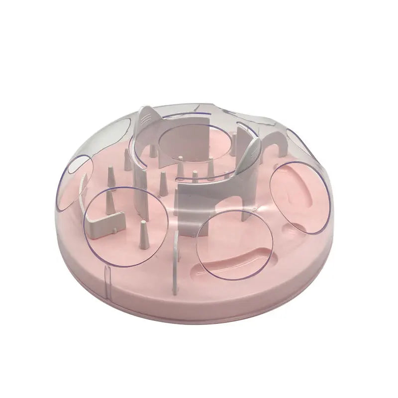 A pink interactive puzzle maze slow feeder bowl for cats and small dogs with various feeding elements.
